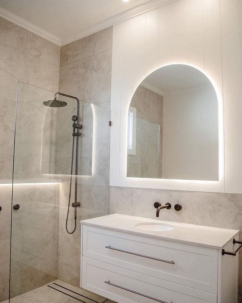 How incredible is this bathroom space by @NavyBoxConstructions?! Achieving the spa like feeling with the Posh Solus back-to-corner bath paired with the timeless white shaker style Kado Lux vanity. Contrasted by the Milli Pure tapware in brushed gunmetal with beige, textured tiles for a bright and inviting bathroom. 

Reece featured products 🛁 :
Milli Pure tapware, Milli Mood shower, Kado Lux vanity, Posh Solus back-to-corner freestanding bath. White And Beige Bathroom, White Shaker Vanity, Gunmetal Tapware, Inviting Bathroom, Textured Tiles, Corner Bath, Beige Bathroom, Freestanding Bath, White And Beige