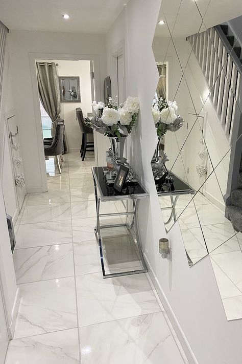 Beautiful hallway with mirror tiles under the stairs. A designer console table has a large bunch of roses on it and there are marble floor tiles throughout. Marble Hallway, Marble Hall, Marble Effect Tiles, Living Room Plan, Luxury Marble, Calacatta Marble, Marble Effect, White Marble, Beauty Salon