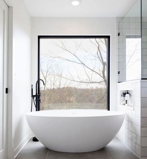 Black, white, and a whole lot of light! This massive picture window brings quite the "wow" factor to this little bathroom nook. Making a small space feel large, the black grille-less window allows light to pour in over this modern white bowl bathtub. Massive Bathroom, Window Bathroom, Large Bathtub, Contemporary Windows, Bathroom Big, Pella Windows, Window In Shower, Bathroom Window, Master Ensuite