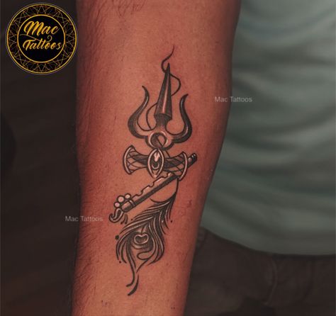 **🎨✨ Divine Symphony Tattoo: Trishul, Damru, Flute & Peacock Feather 🕉️🕊️**  

Immerse yourself in the perfect blend of spirituality and artistry with this stunning forearm tattoo! 🌟  

- **Trishul & Damru**: Symbols of Lord Shiva’s unmatched power and cosmic rhythm. 🌀🔥  
- **Flute & Peacock Feather**: Representing Lord Krishna’s enchanting melody and divine love. 🎶✨  

This masterpiece reflects harmony, faith, and your personal connection to the divine. Perfect for anyone who carries spirituality in their soul and art on their skin. 💖  

📞 **Book your session now: 8851 012 863**  
💬 **DM us to create your story in ink!**  

#TrishulTattoo #DamruTattoo #FluteTattoo #PeacockFeatherTattoo #DivineInk #SpiritualArt #ForearmTattoo #ShivaTattoo #KrishnaTattoo #SacredSymbols #TattooInsp Tattoo Trishul, Flute Tattoo, Krishna Tattoo, Peacock Feather Tattoo, Personal Connection, Shiva Tattoo, Create Your Story, Divine Love, Sacred Symbols