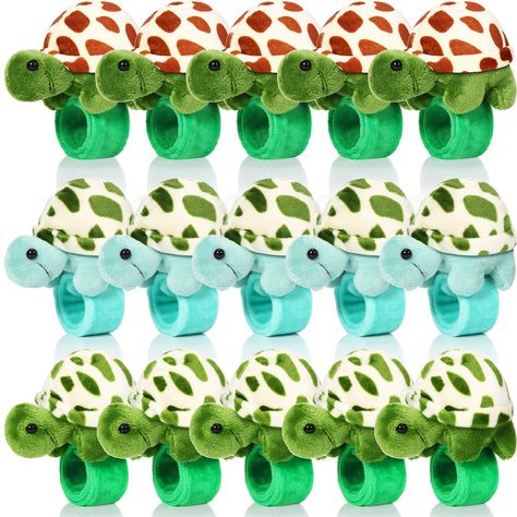 PRICES MAY VARY. Sufficient Quantity: you will receive 15 pieces stuffed turtle slap bracelet party favors in 3 different styles, 5 pieces for each color, which are exquisite and adorable, can easily get people's attention; You can wear them, share with others, or keep them as special bracelet collections Proper Size: the stuffed turtle animal slap bracelets measure about 8.66 inches/ 22 cm, fit comfortably on most wrists without slipping off, making them ideal accessories for most people who lo Turtle Slap, Turtle Birthday Theme, Turtle Decorations, Lizard Party, Sea Party Favors, First Birthday Party Favors, Turtle Birthday Party, Stuffed Turtle, Goodie Bag Stuffers