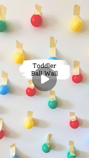 Melissa Kate on Instagram: "Set up the night before, surprise your toddler 🙌  We love vertical play with a ball wall 🟢🔵🔴 Use some colored balls like from the ball pit and secure with painters tape. For littles, they'll love pulling them off and placing in a basket. Older toddlers you could ask for specific colors too! Follow for more fun! 🎉  #kidsactivities #toddlermom #kidsactivityideas #kidsactivity #toddlerplay #boymom #momsofinstagram #momtips #momtricks #toddler #indooractivities #indooractivitiesforkids #toddlersofinstagram #toddlerfun #kidscraftideas #toddlercraftideas #toddlercrafts #momhack #asmr #playbasedlearning #preschoolactivities #preschoollearning #kidslearning" Ball Pit Balls, Playbased Learning, Wall Balls, Learning Goals, Indoor Activities For Kids, Toddler Mom, Games For Toddlers, Toddler Play, Toddler Fun