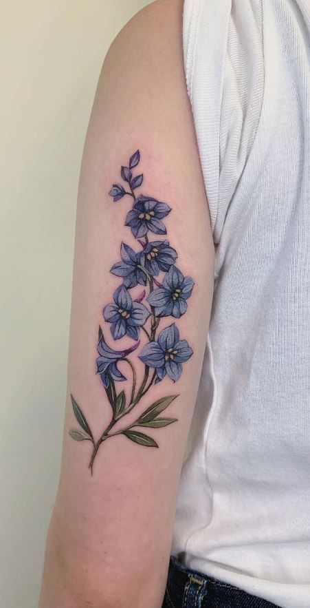 Larkspur Sleeve Tattoo, Art Nouveau Larkspur, Filler Designs For Tattoos, Larkspur Hip Tattoo, Tall Flower Tattoo, Purple Larkspur Tattoo, Larkspur Birth Flower Tattoo, Blue Star Flower Tattoo, Larkspur Wrap Around Tattoo