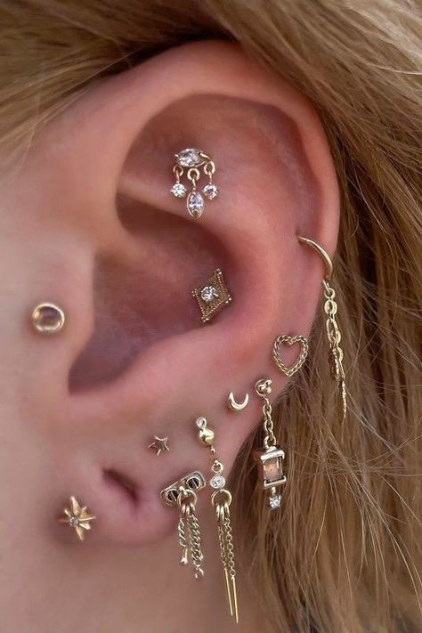 We love getting to see what @adornedbyamelia (IG) adds to her stunning ear curation!  Visit Amelia at Scarecrow Galleries Tattoo for styling needs of your own.  Amelia wears: Stargazer - Flat⁠ Cherish with Diamond - Mid helix⁠ Lucidity - Conch⁠ Heart In Chains - Low helix ⁠ No Masters - Lobe ⁠ Sparkle Motion - Lobe⁠ Chain Reaction Traditional - Lobes Floating Helix Piercing, Low Helix Piercing, Septum Earrings, Ear Curation, Back Piercings, Piercing Studio, Chain Reaction, Ear Weights, Helix Piercing