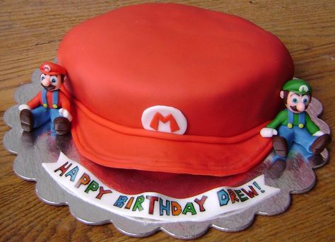 Super Mario Bros. Hat Cake www.facebook.com/eatcakesiowa Mario Hat Cake, Toad Birthday Cake Mario Party, 2 Tier Mario Cake, Super Mario Cake 1 Tier, Mario Cake 2 Tier, Mario Hat, Cap Cake, Mario Cake, Hat Cake