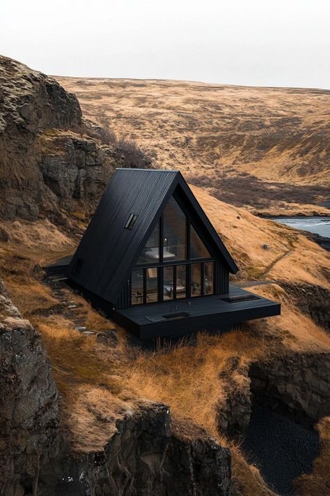 Aerial view of a black a frame modern house in stunning Icelandic landscape with contrasting colors. Ready to embrace the dark side of design? Get inspired by the bold, dramatic beauty of black houses. Black A Frame Cabin, Mountain A Frame, Airbnb House Design, Chic Cabin, A-frame Interior, House Balcony, Modern Ranch House, Black Houses, Dark House