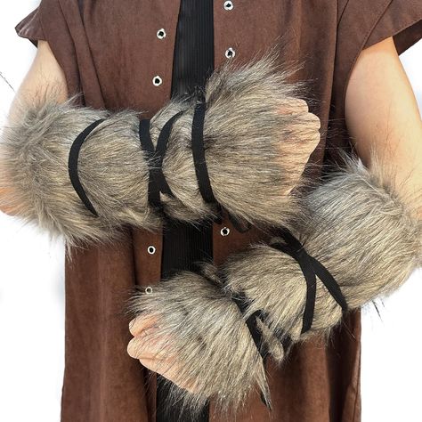 PRICES MAY VARY. COOL DESIGN- Vintage style, soft lining, cozy and comfortable as if the warm winter sun wraps around your arms, adding a touch of Viking wildness to your outfit. GRADE ARTIFICIAL FUR- Handcrafted with the atmosphere of the times, premium Artificial Fur but has the feel of genuine fur, cheaper and more protective than genuine leather. We love animals and all the living kinds! ADJUSTABLE- One size fits all. Vintage wrap around wearing style, it can be adjusted at will to ensure a Animal Hide Clothing, Animal Pelt Clothing, Viking Winter Clothing, Fur Gauntlets, Fur Arm Warmers, Wasteland Fashion, Arm Wraps, Wolf Clothing, Arm Guards