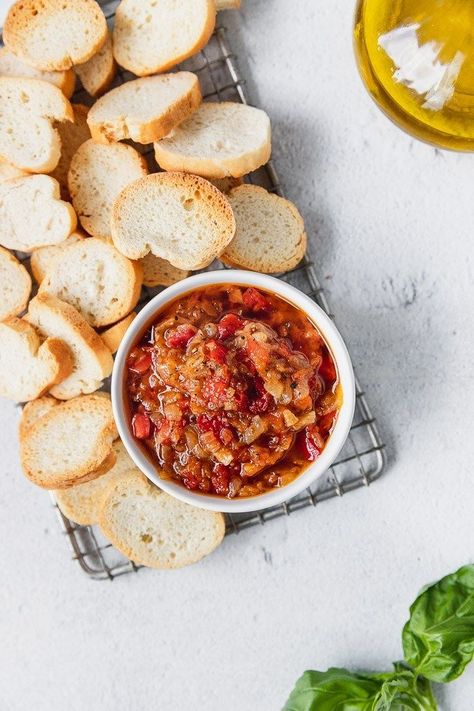 This melt-in-your-mouth jammy-like tomato-onion-red pepper spread is absolutely worthy of a 1-hour simmer. It's a delicious appetizer all on its own, spread on a cracker or crostini, or as an addition to a cheeseboard. Endless possibilities! | Fork in the Kitchen #appetizer #recipe #forkinthekitchen Crostini Toppings, Green Olive Tapenade, Crostini Appetizers, Gourmet Appetizers, Homemade Buffalo Sauce, Crowd Pleasing Appetizers, Easy Dips, Vegetarian Appetizers, Sour Cream And Onion