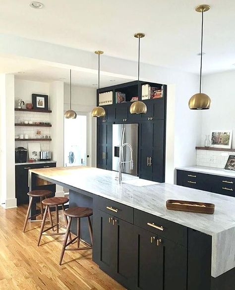 Dark kitchen cabinets can be dramatic, bold & striking. Learn how to find the right lighting, flooring, countertops & more to complement your dark cabinets on our latest blog!........................... with light granite \ farmhouse \ backsplash \ rustic \ white counters \ grey walls \ grey floor \ hardware \ paint \ decor \ black appliances \ lily ann blogs Waterfall Countertop, Craftsman Bungalow, Black Kitchen Cabinets, Decor Ikea, Classic Kitchen, Kitchen Trends, Black Cabinets, Kitchen Diner, Apartment Kitchen