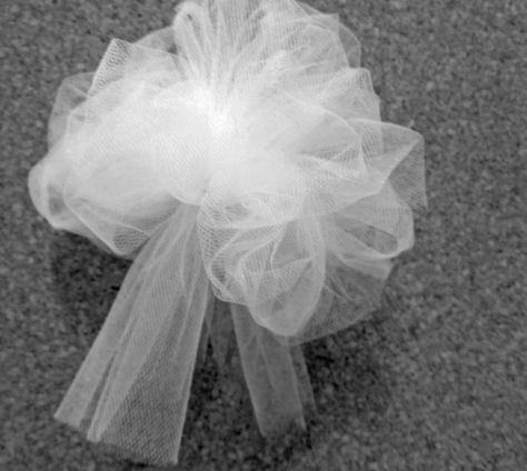 After I saw the price of tulle bows ($7.99 for one bow!), I decided to buy tulle and make them myself.     I made two sizes: large bows t... How To Make Tulle Bows For Wedding, Bows Made With Tulle, Tule Bows Diy How To Make, How To Decorate With Tulle, How To Make Tulle Bows, Tulle Bows For Wedding, Tulle Bows Diy, Diy Wedding Aisle Decorations, Diy Tulle Bow