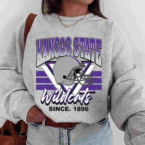 Vintage Bootleg Ncaa Kansas State Football Sweatshirt, Kansas State Football Shirt, Kansas State-Wildcats Mascot Sweatshirt, Gift For Fans Product Information Promise That You Will Get The Best Products We Have. With Variety Of T Shirts Styles, Sizes And Colors. -------- Sweatshirt - Gidan 18000 -------- "Spun Yarn For Softer Feel And Reduced Pilling Double-Needle Stitching At Shoulders, Armholes, Neck, Waistband And Cuffs 1x1 Rib With Spandex For Enhanced Stretch And Recovery Classic Fit Tubula Kansas State Football, Dallas Cowboys Shirts, Nebraska Football, Pink Singer, California Sweatshirt, Kansas State University, University Shirt, University Sweatshirts, Football Sweatshirt