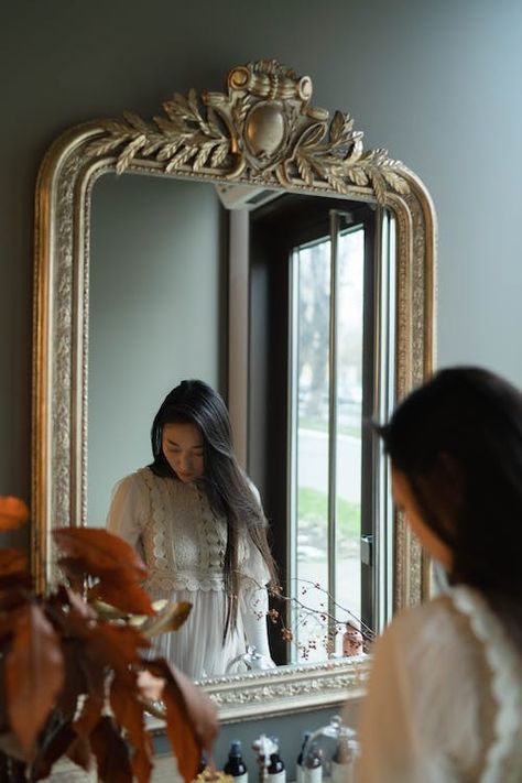 Woman in White Blouse Standing in front of a Mirror · Free Stock Photo Adam Style Architecture, Mommy In Heels, Construction Bedding, Online Garage Sale, Gold Ornate Mirror, Photography Office, Woman In White, Adam Style, Mommy Workout