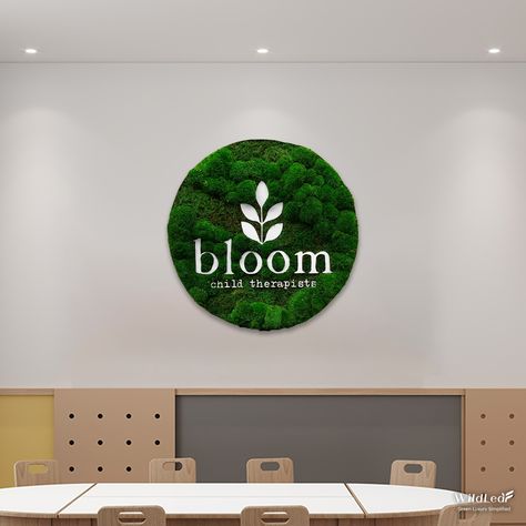 The round moss logo for a children's health organization combines layered Bun Moss and Sheet Moss to contrast the crisp white PVC logo. Moss Quotes Nature, Moss Signage, Round Moss Wall Art, Moss Logo, Moss Logo Wall, Scandinavian Moss, Creating A Logo, Sheet Moss, Logo Nature