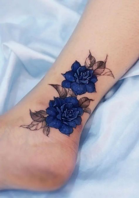 Blue Rose Tattoos: Meanings, Tattoo Designs & Placement Blue Rose Tattoo Meaning, Cosmetology Tattoos, Ankle Tattoo Cover Up, Rose Tattoo On Ankle, Blue Flower Tattoos, Tatuaje Cover Up, Rose Tattoos For Women, Blue Rose Tattoos, Ankle Tattoos For Women