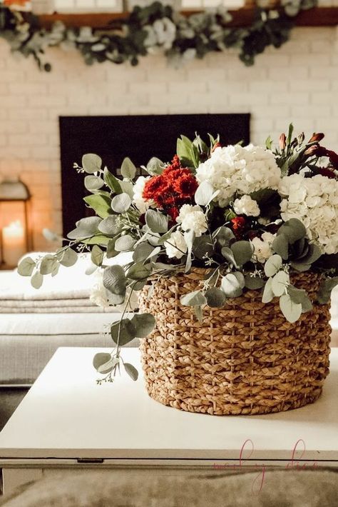 Learn how to make this pretty arrangement in a basket and still water your real flowers! Subscribe to my blog A Brick Home for more DIY & decorating projects like this! HOW TO MAKE THIS EASY FLOWER ARRANGEMENT IN A BASKET:1.Gather materials. For this project, you'll need: a large basket a flower vase that's 2/3 the height of your basket real flowers (from the grocery store) faux eucalyptus stems 2.Make your arrangement using your real flowers stems in your vase.You can use an… Basket Flower Arrangements, Fall Flower Arrangements, Fall Florals, Fall Flower, Faux Flower Arrangements, Flower Arrangements Simple, Brick Home, Floral Centerpiece, Original Photo