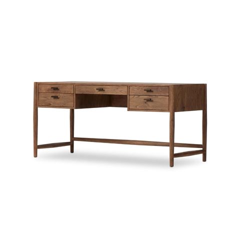 Traditional, reimagined. Made from rustic weathered oak, this desk brings generous storage space to the office. Simple hardware is finished in an aged bronze.Product Overview Finish: Aged Bronze Dimensions: 67.5"W x 27.5"D x 31"H Materials: Iron, Thick Oak Veneer, Solid Oak Weight: 148.37 lb Specifications Distance Bet Iron Desk, Wood Writing Desk, Iron Hardware, Aged Bronze, Amber Interiors, Weathered Oak, Executive Desk, Four Hands, Burke Decor