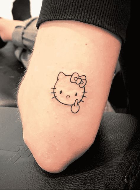 Hello Kitty Tattoo Design Images (Hello Kitty Ink Design Ideas) Hello Kitty Tattoo For Men, Hello Kitty Skull Tattoo, Hello Kitty Fine Line Tattoo, Hello Kitty Outline Tattoo, Emo Hello Kitty Tattoo, Hello Kitty Tattoo Ideas Design, Matching Tattoos Hello Kitty, Hello Kitty Henna Design, Tatuajes Hello Kitty