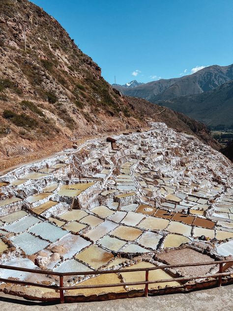 Need another cool thing to see in Peru? Salineras De Maras, or the Salt mines of Maras are largest salt extraction centers of prehispanic origin in Peru. Maras town is also in the Sacred valley of the Incas. You can get to this village by public transport. Follow along for more places to visit! Maras Salt Mines Peru, Sacred Valley Peru, Peru Trip, Travel Peru, Salt Mine, Andes Mountains, Sacred Valley, Peru Travel, Dream Destinations