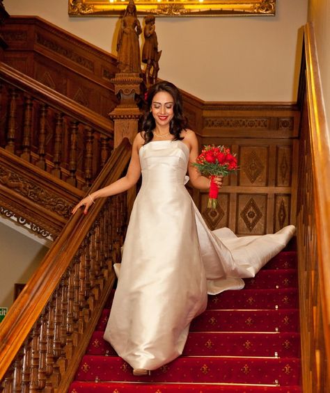 Bride walking down the stairs red colour scheme Bride Coming Down Stairs, Walking Down Stairs Reference, Carved Staircase, Perspective References, Walking Down Stairs, Gown Aesthetic, Dream Wedding Locations, Wedding Photo List, Cotswolds Wedding