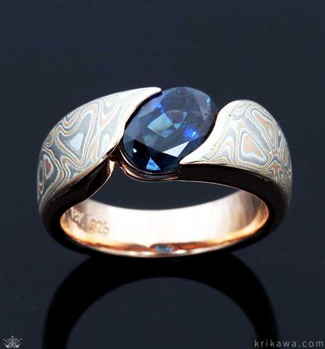 Mokume Wave Engagement Ring with an oval sapphire solitaire! Pictured here in 14k rose gold and our Champagne Mokume. Customize this design by choosing your favorite metal, mokume and solitaire stone! Oval Stone Ring Design Gold Men, Mens Ring Designs, Vintage Gold Engagement Rings, Mens Gold Jewelry, Engagement Ring White Gold, Aquamarine Engagement Ring, Engagement Rings Round, Classic Engagement Rings, White Gold Engagement Rings