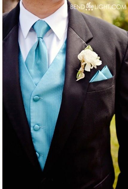 Groomsmen attire: black suit, white shirt, blue vest, blue tie, and they would have a blue boutonnière. Same shade of blue as the bridesmaids' dresses. Blue Wedding Groomsmen, Blue Suit Groomsmen, Wedding Blue Suit, Wedding Suits Men Blue, Blue Groomsmen Suits, Suit Groomsmen, Blue Groomsmen, Teal Bridesmaid Dresses, Wedding Tux