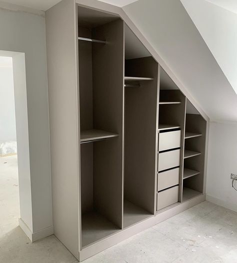 Attic Closet Solutions, Walk In Closet Roof Slope, Closets For Angled Ceilings, Angled Wardrobe Ideas, Sloping Roof Closet, Built In Eaves Wardrobe, Small Walk In Closet Ideas Slanted Roof, Slanted Roof Wardrobe Ideas, Walk In Wardrobe Design Ideas