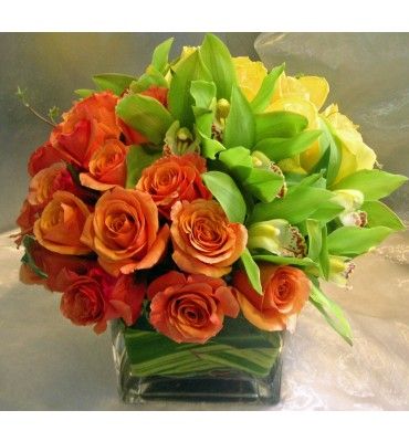 Orange and yellow roses with Green cymbidium orchids. Yellow Floral Arrangements, Floral Products, Flower Chart, Orange Bouquets, Candle Wedding Centerpieces, Unique Flower Arrangements, Cymbidium Orchids, Bouquet Arrangements, Fresh Flowers Arrangements