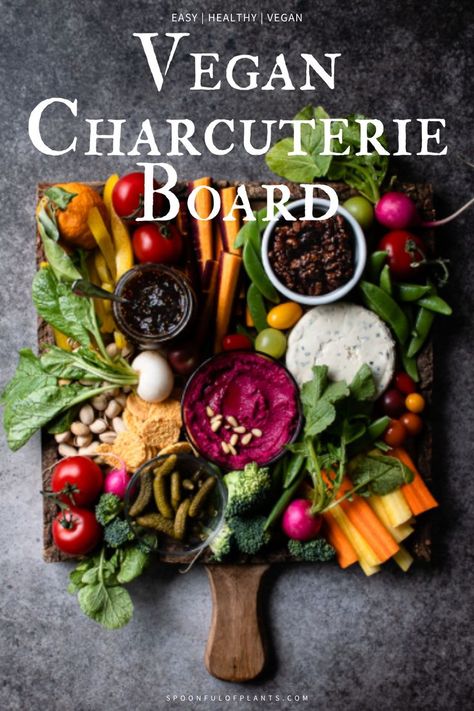 Vegan Charcuterie Board | Spoonful of Plants | A delicious and visually pleasing plant-based charcuterie board made with fresh vegetables, hummus, vegan cheese, nuts and spreads. The perfect appetizer and snack board for entertaining or to share with family. Vegan Charcuterie Board, Garlic Hummus Recipe, Vegan Side Dishes, Snack Board, Vegan Beans, Vegan Sides, Visually Pleasing, Raw Vegetables, Hummus Recipe