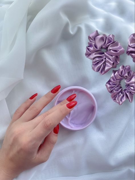 A lilac face mask, hand wearing bright red nail polish White Aesthetic Skincare, Beige Aesthetic Skincare, Flatlay Aesthetic, Hand Aesthetic, Lilac Aesthetic, Cosmetics Aesthetic, Aesthetic Nail, Violet Aesthetic, Red Manicure