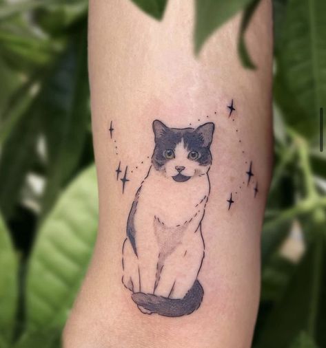 A minimalist cat tattoo can be a charming and subtle way to express your love for felines. Consider a simple outline of a cat's silhouette, perhaps with clean lines and minimal detail. You could opt for a small design on your wrist, ankle, or behind the ear for a discreet yet stylish look. Black ink tends to work well for minimalist tattoos, but you could also explore other subtle colors if you prefer. Just ensure you find a talented tattoo artist who specializes in minimalist designs White And Black Cat Tattoo, Porcelain Cat Tattoo, Cat Tattoo Tuxedo, Custom Cat Tattoo, Cat Tattoo Designs Memorial, Pet Tattoos Cat Memorial, Tortie Cat Tattoo, Cat Tattoo Portrait, Cute Black Cat Tattoo