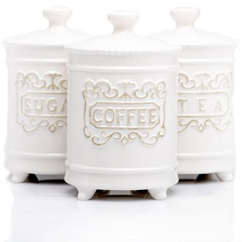 PRICES MAY VARY. Ceramic Canisters That Serve More Than One Purpose: These 4.5” farmhouse canisters for kitchen counter not only provide a place for you to neatly store three of the most common kitchen items, but they'll also bring a touch of class to your home Store Those Daily Brews and Sugar In Style: Included are three 25-ounce ceramic canisters with lids; These stylish white canisters stand out with their unique, eye-catching shape and beautiful engravings of the words Coffee, Tea, and Suga Ceramic Kitchen Canister Sets, Farmhouse Canisters, Ceramic Kitchen Canisters, Ceramic Canister Set, White Canisters, Coffee Bar Station, Sugar Storage, Ceramic Canisters, Kitchen Canister Set