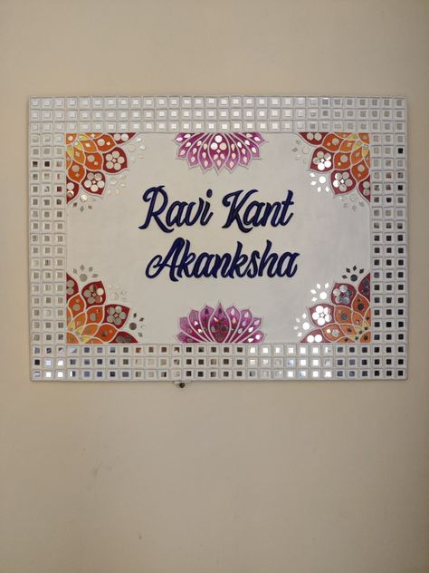 Motifs and mirrors are combined to make this beautiful customised handmade nameplate on 18"×24" board... Mirror Work On Mdf Board, Lippin Art Name Plate, Name Plate Lippan Art Ideas, Lippan Art Mirror Name Plate, Handmade Nameplate Ideas, Mosaic Nameplate, Lipan Art Nameplate, Lippan Art Name Plate Design, Lippan Art Name Plate