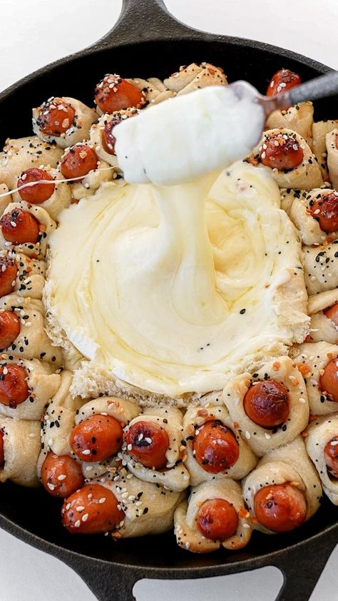 Baked Brie and Pigs in a Blanket Pull-Apart Bread with Cheat Day Eats Ingredients 2 13.8-oz refrigerated pizza dough sheets 1 35-count package of mini hot dogs 1 8-oz wheel of Brie 1 tbsp unsalted butter, melted Everything bagel seasoning | Tasty Mini Hot Dogs, Refrigerated Pizza Dough, Everything Bagel Seasoning, Bagel Seasoning, Pull Apart Bread, Cheat Day, Pigs In A Blanket, Baked Brie, Everything Bagel