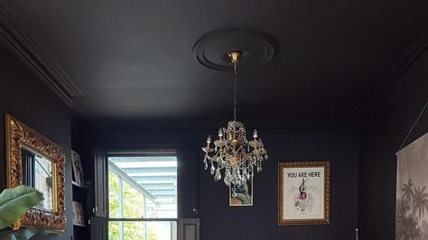 The Ceiling Painting Hack That Makes Any Room Look Bigger Painting Bathroom Ceiling Dark, Dark Ceilings Lighter Walls, Black Walls And Ceiling, Black Tray Ceiling, Dark Ceiling Light Walls, Painting A Room, Room Look Bigger, Dark Ceiling, Ceiling Painting