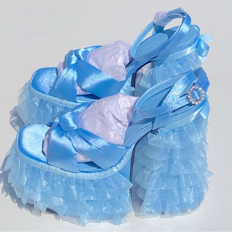 Sugar Thrillz Platform Layered Lace Satin Crystal Blue Sandals Heels Size 9 Feature A Satin Construction, A Ruffled Tulle Trim On The Platform Soles And Block Heels, A Bow Trim In The Back, Knotted Foot Uppers, And Rhinestone Buckle Closures. Details: Light Blue Man Made Materials 6" Heel 3" Platform Sugar Thrillz Shoes, Diy Heels, Blue Sandals Heels, Pink Slides, Dr Shoes, Sugar Thrillz, Funky Shoes, Girly Shoes, Blue Heels