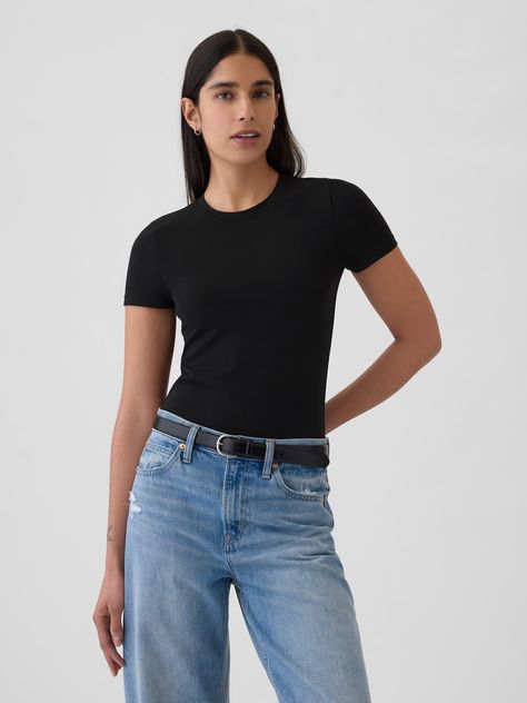 Soft, stretchy cotton-modal blend T-shirt bodysuit.  Crewneck.  Short sleeves.  Snaps at inseam.  Full coverage back.  * Fit: Slightly fitted.  Sits close to the body.  Models wearing Gap Short Sleeve Bodysuit Outfit, Black Tee Outfit, Outfit Tomboy, Shirt Bodysuit, Body Suit Outfits, Bodysuit Black, Fitted Tee, Short Sleeve Bodysuit, Work Shirts