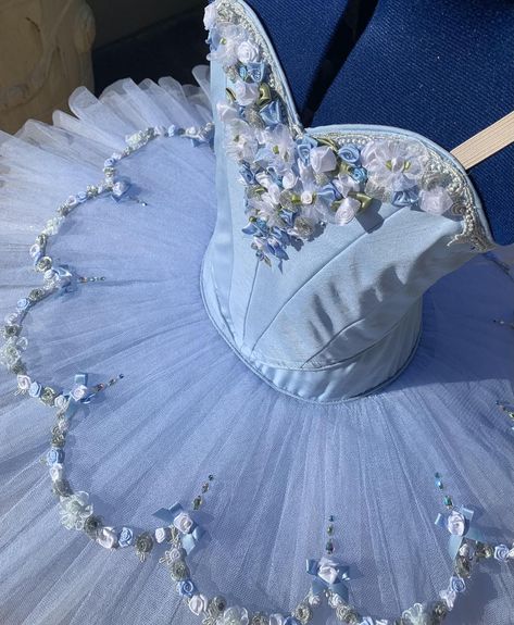 Beautiful blue flower tutu, traditional piped sweetheart bodice. Fully lined with blue and white ribbon roses, bows embellishing the bodice and metallic silver trim. The Tutu skirt has 9 full layers of alternating blue and white nets, with crystal tulle trim to give an extra depth of color with a flower overlay with more ribbon roses and crystals. Hook and eye closure. Custom Made. Delivery time: 5 to 7 weeks $1000 AUD plus postage Tutu Skirt Ballet, Blue Ballet Costume, Blue Ballet Dress, Flower Overlay, Ballet Costumes Tutus, Preppy Chic Outfits, Pancake Tutu, Skirt Tutu, Ballerina Costume