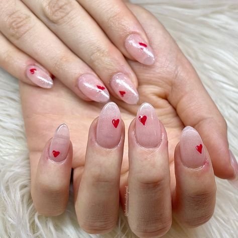 Simplicity at its best!! Almond shaped gel nails with sheer glitter and tiny red heart on each nail love it!! Heart Nails Almond Shape, Cute Short Polygel Nails, Tiny Heart Nail Art, Tiny Hearts Nails, Nails With Tiny Heart, Tiny Nail Art, Glitter Heart Nails, Tiny Heart Nails, Peach Nail Art