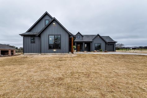 The dark colors Charcoal Metal House, Black Single Story House, Charcoal Grey Barndominium, Mountain House Exteriors, Dark Houses, Dark Exterior House, Barn Colors, Charcoal House, Moody Farmhouse