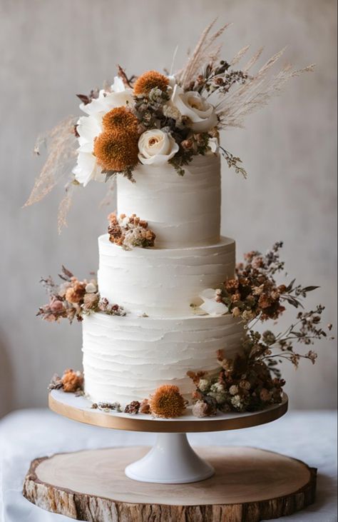 White tiered wedding cake with dried flowers Boho Wedding Cake Florals, Elegant Boho Wedding Cake, Terracotta Cake Wedding, Real Flower Wedding Cake, Carrot Wedding Cake Rustic, Cookies And Cream Wedding Cake, Fall Flowers Cake, Small Boho Wedding Cake