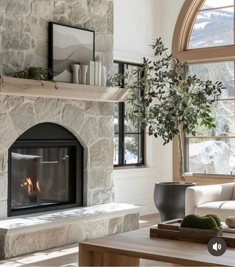 Stone Face Fireplace, Lake House Fireplace Ideas, Whitewashed Stone Fireplace, White Stone Fireplace With Wood Mantel, Modern Cottage Fireplace, Arched Stone Fireplace, Riverstone Fireplace, Stone Fireplace With Hearth, Half Stone Fireplace