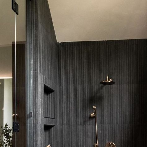 TileBar on Instagram: "This bathroom, designed by @cm.interiors, brings out the best in our Kenridge Ribbon tile, styled with dark fixtures and warm wood accents to enhance its understated elegance. The seamless wood-look porcelain tile, paired with textured stones underfoot, creates a balanced, tranquil retreat.⁣
- Kenridge Ribbon in Black" Ribbon Tile Bathroom, Dark Shower Tile, Dark Shower Tile Ideas, Kenridge Ribbon, Shower Tile Ideas, Tranquil Retreat, Wet Room, The Spa, Busy Life