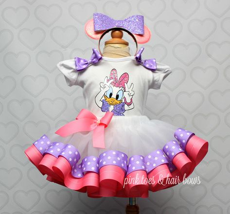 Checkout our fun and frilly tutu sets! Perfect for any party,custom made just for your little one. Each set includes a custom tee,tutu,and a hairbow. We have so many styles to choose from,If you dont see what you are looking for, please email us, we accept custom orders,and can make something extra special for your spe Duck Outfit, Daisy Duck Party, Minnie Y Daisy, Pata Daisy, Groove Cruise, Minnie Mouse Birthday Theme, Duck Party, Diy Tutus, Duck Dress