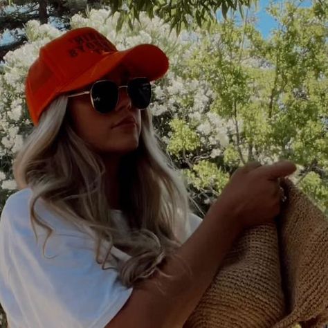 Lexie Marie on Instagram: "Quick road-trip outfit check🚗🧡📸 My favorite shorts of all time @tacoolathelabel - let me just say I normally hate jean shorts but Tacoola does them best! These are the Stella short and I also have the Honey! Tee & trucker hat @blue_jean_b3auty_ Sunnies @elusive_eyewear Bag @mondayswimwear Hair @monatofficial" Orange Trucker Hat Outfit, Trucker Hat Outfit Women, Trucker Hat Outfit, Road Trip Outfit, Hat Outfits, Trip Outfit, Yee Yee, Hat Outfit, Trip Outfits