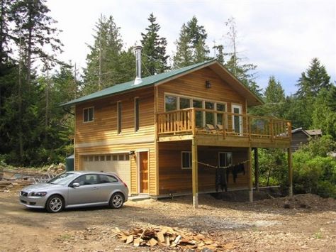 This small 576 square foot house is located on Gabriola Island in British Columbia and has two stories, a 24′ by 24′ footprint, type-3 septic field, instant hot water heater, and cork floors. Plan Garage, Landscaping Around House, Garage Loft, Garage Apartment Plans, Garage House Plans, Garage Apartment, Apartment Plans, Small Cabin, Cabins And Cottages