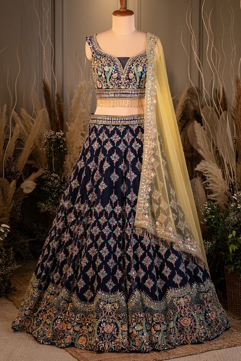 NAVY BLUE LEHENGA SET WITH MULTI COLOURED EMBROIDERY AND GOTA WORK PAIRED WITH A CONTRAST YELLOW DUPATTA AND TASSELS. - Seasons India Navy Blue Lehenga, Indowestern Dresses, Yellow Dupatta, Orange Lehenga, Blouses Designs, Kids Blouse, Gota Work, Blue Lehenga, Indian Saree Blouse