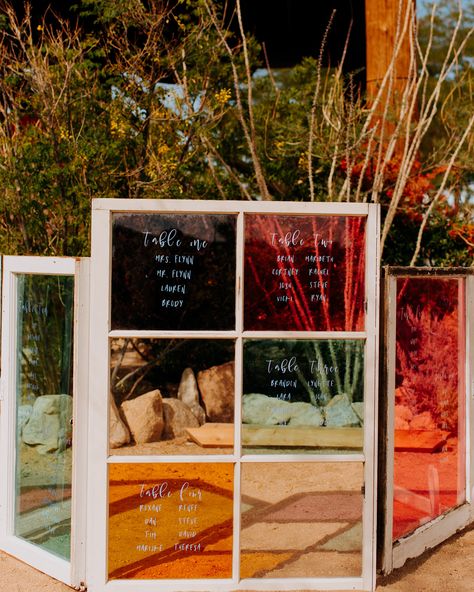 Turning repurposed, stained-glass windows into a seating chart is simple and yields gorgeous results. Wild Heart Events used only white marker to finish off this colorful iteration. Nontraditional Wedding Arch, Stained Glass Table Decor, Simple Seating Chart Wedding Ideas, Burnt Orange Wedding Ideas, Glass Seating Chart, Mosaic Wedding, Wedding Stationary Design, White Marker, Rustic Arrangements