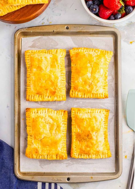 Craving a homemade twist on a classic favorite? Try this recipe for breakfast hot pockets! Filled with savory sausage, fluffy eggs, melted cheese, and colorful peppers, wrapped in golden puff pastry. Perfect for on-the-go mornings or a satisfying snack anytime. This recipe not only tastes better than the store-bought version but is healthier too, with no preservatives. Easily freezable, enjoy a delicious, convenient breakfast option whenever you need it. Make your mornings easier and tastier! Breakfast Pockets With Puff Pastry, Homemade Breakfast Hot Pockets, Puff Pastry Hot Pockets, Breakfast Puff Pastry Recipes Savory, Diy Hot Pockets, Hot Pockets Homemade, Breakfast Hot Pockets, Childhood Recipes, Breakfast Puff Pastry