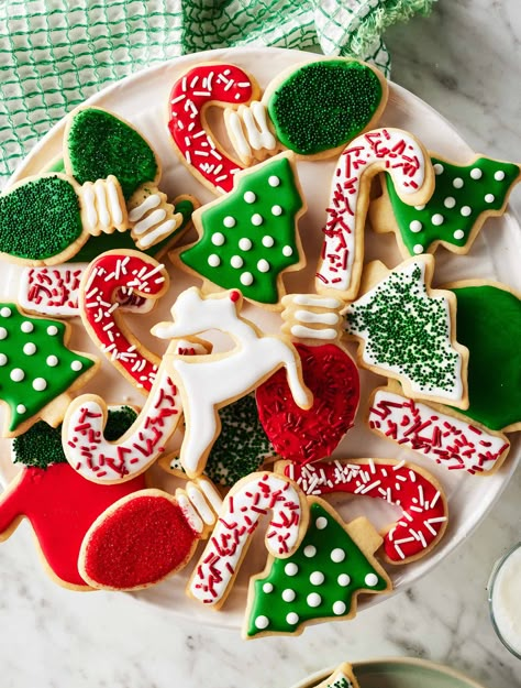 These easy cut-out sugar cookies have crisp edges, soft middles, and a delicious buttery flavor. They're perfect for decorating for Christmas, Valentine's Day, or any occasion! Sugar Cut Out Cookies Recipe, Soft Cut Out Sugar Cookie Recipe, Decorating Sugar Cookies Christmas, Best Cut Out Sugar Cookie Recipe, Sugar Cookie Recipe Cut Out, Easy Sugar Cookie Decorating, Christmas Sugar Cookie Decorating, Sugar Cut Out Cookies, Sugar Cookie Cutout Recipe