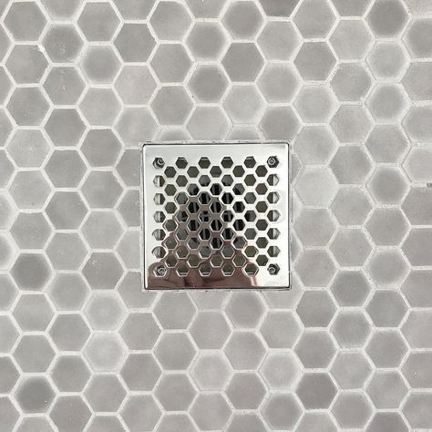 Shower drains are necessary, but they don’t have to be generic. Here we chose a square plate with a hex grid pattern to coordinate with the mosaic floor tile. And if that wasn’t enough of a reason to get one, the decorative grid simply lifts up for easy cleaning. 👍🏼⠀ •⠀ #bathroompic #bathroomdecor #bathroomremodel #bathroomdesign #remodeling #designbuild #residentialdesign #704lifestyle #homeinteriors #casedesignclt #masterbath #bathroominspo #charlottenc #homeremodeling #remodelingcontractors Mosaic Shower Floor Tile, Mosaic Shower Floor, Hex Tile Floor, Master Suite Remodel, Bathroom Makeovers, Bathroom Model, Shower Floor Tile, Mosaic Floor Tile, Mosaic Floor